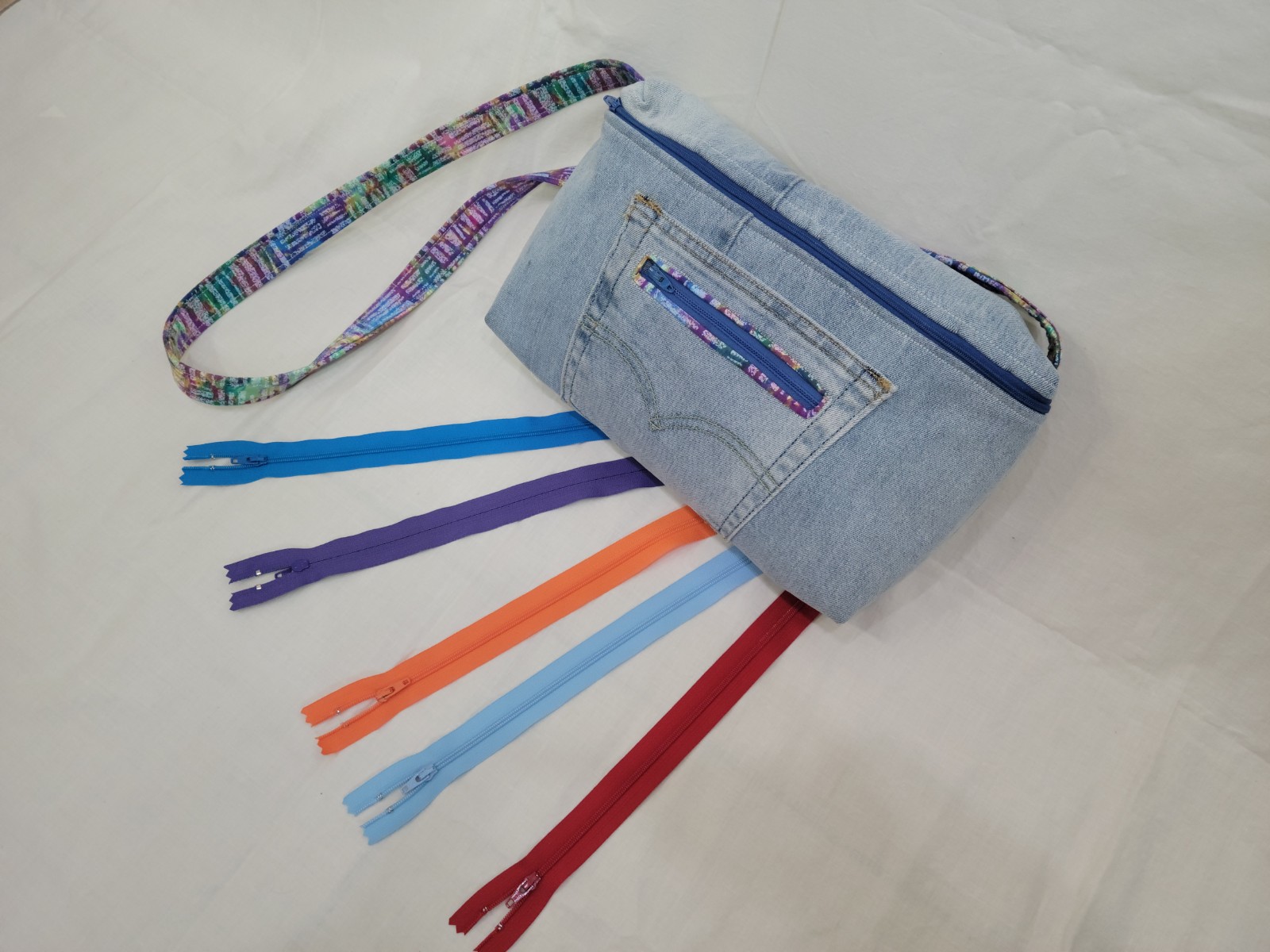 zip up fantasy bag with multiple colored zippers